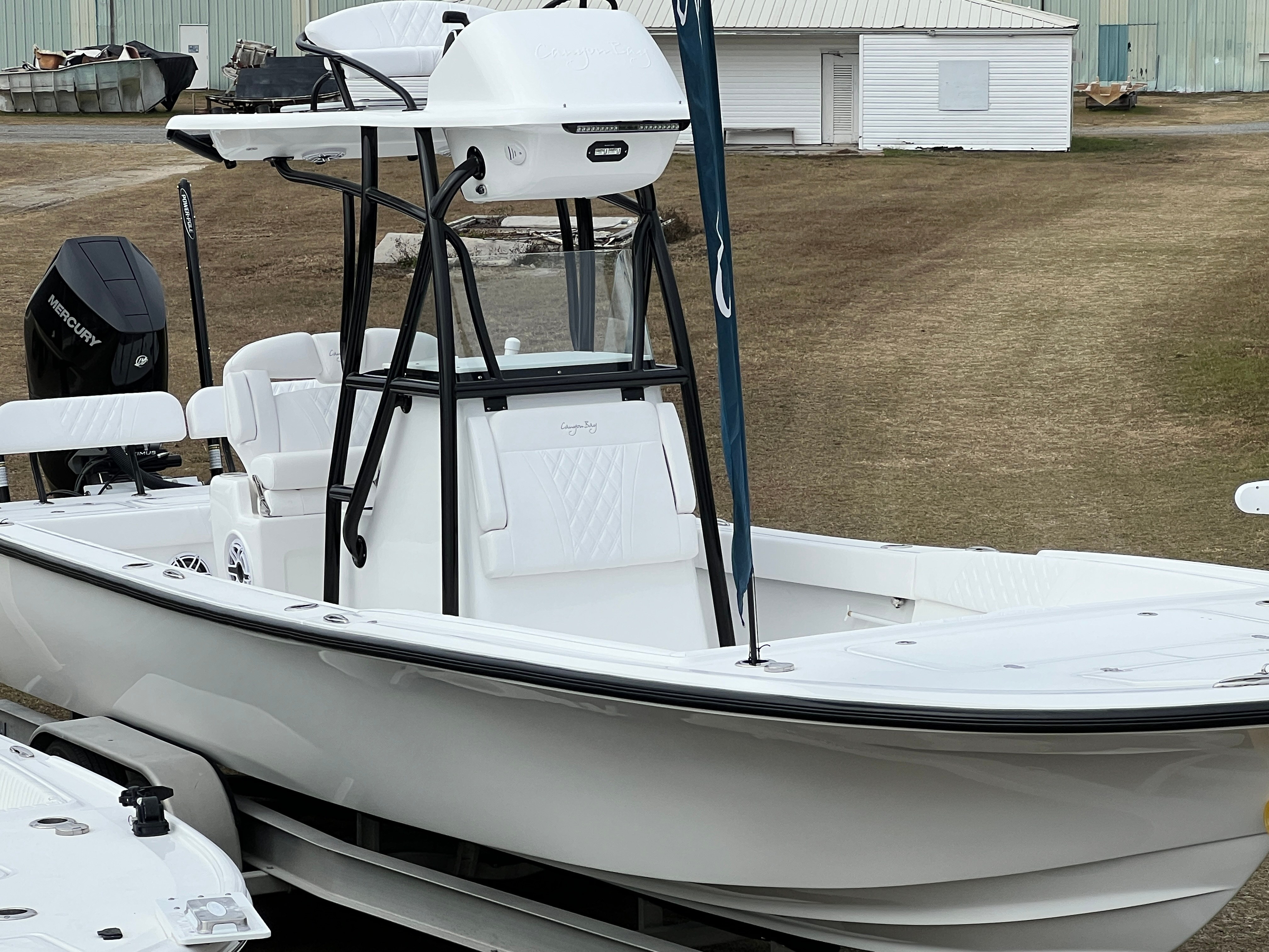 Canyon Bay 24h white hull mercury dealership display